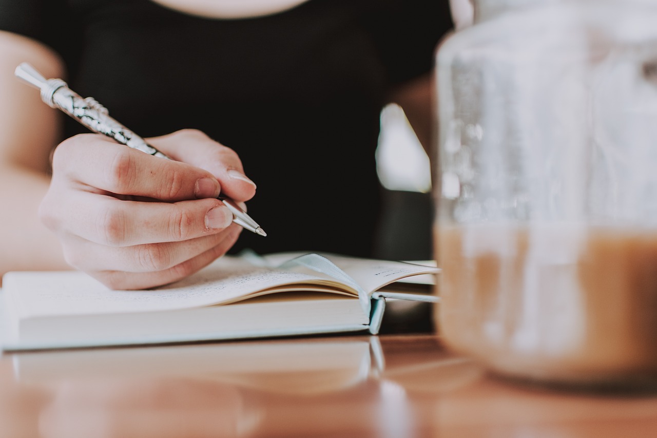 Photo via Pexels/Pixabay Writing with coffee